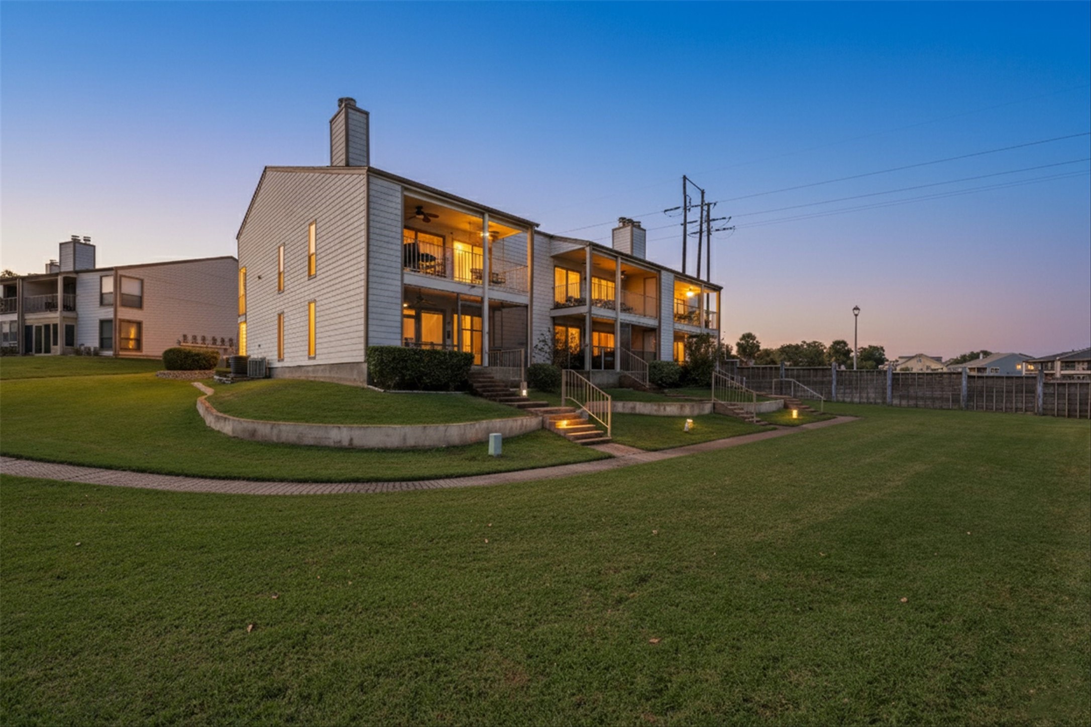 202 Lakeview Terrace, Unit A Conroe, TX 77356 - Photo 39 of 45 a front view of a building with play ground and trees