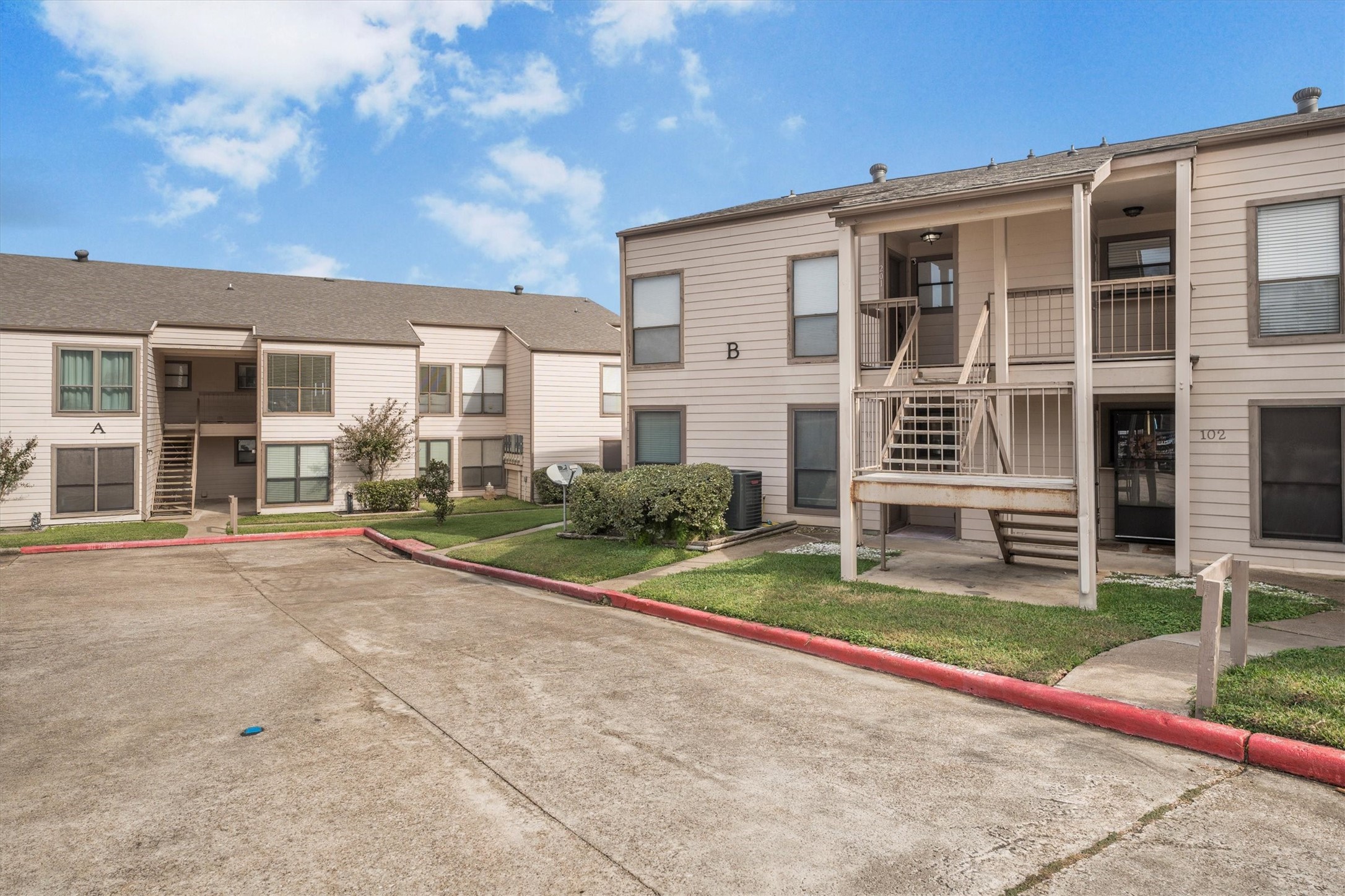 202 Lakeview Terrace, Unit A Conroe, TX 77356 - Photo 40 of 45 front view of a house with a yard