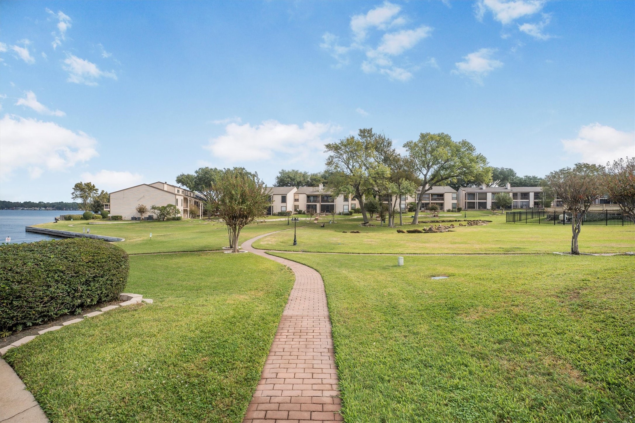 202 Lakeview Terrace, Unit A Conroe, TX 77356 - Photo 41 of 45 a view of a swimming pool with a yard