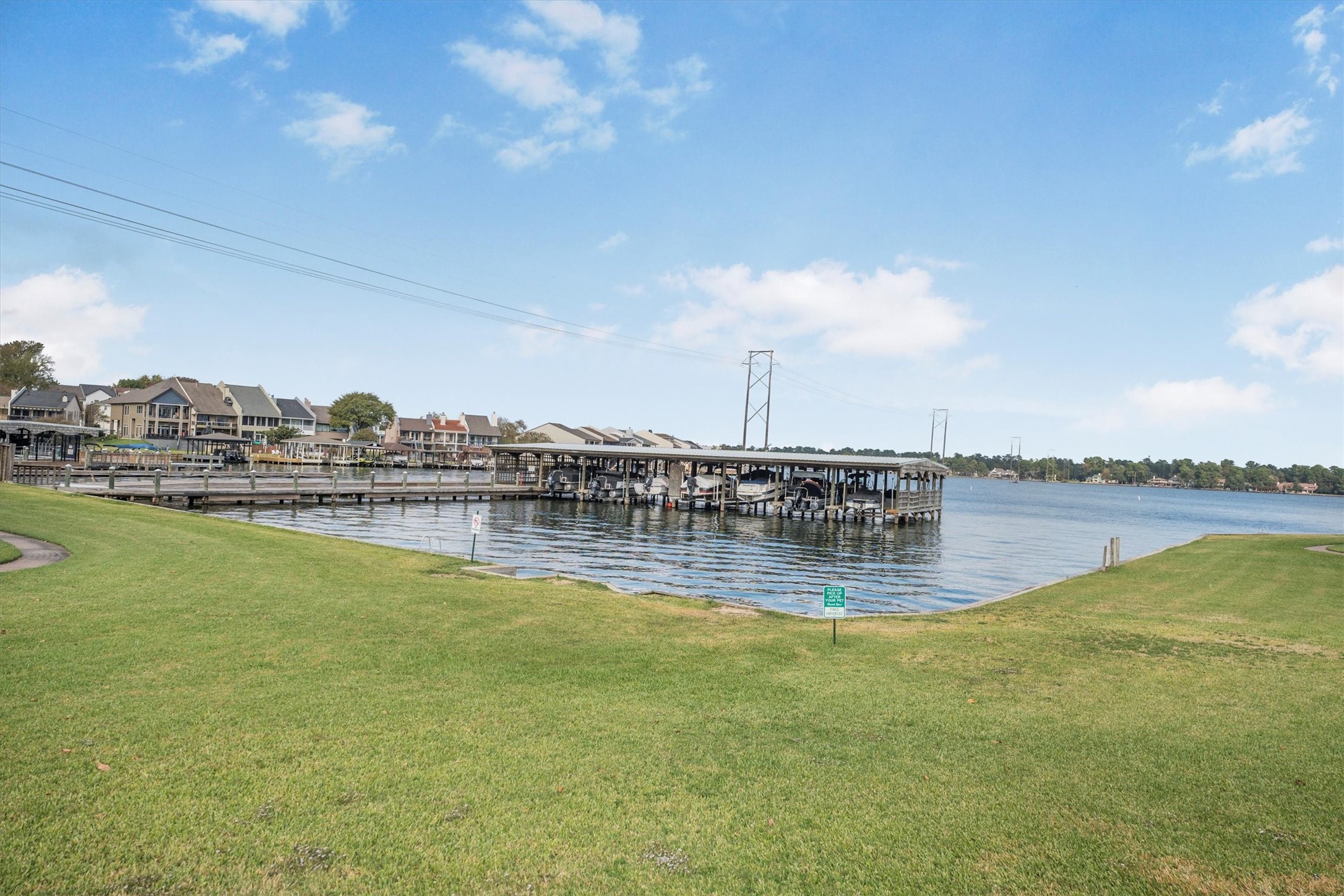 202 Lakeview Terrace, Unit A Conroe, TX 77356 - Photo 42 of 45 a view of swimming pool with outdoor seating and yard