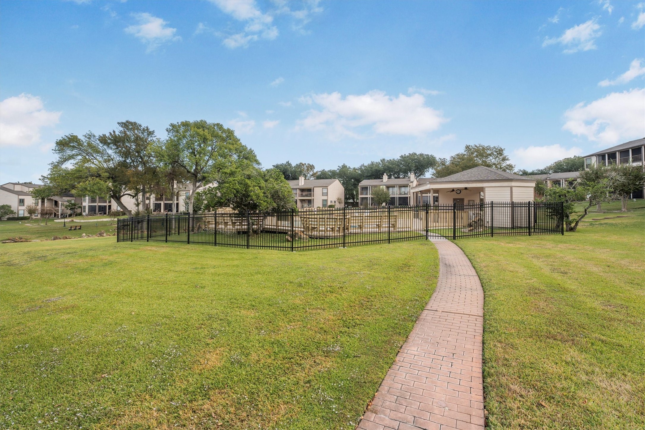 202 Lakeview Terrace, Unit A Conroe, TX 77356 - Photo 43 of 45 a view of a swimming pool is middle in the garden