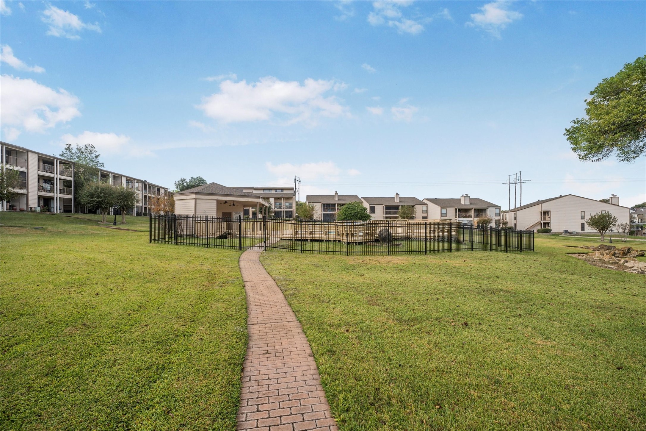 202 Lakeview Terrace, Unit A Conroe, TX 77356 - Photo 44 of 45 a view of a swimming pool and a yard