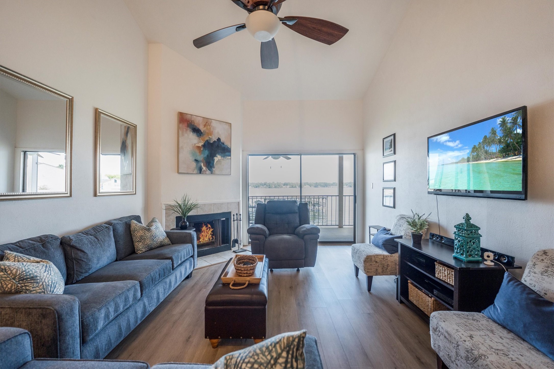 202 Lakeview Terrace, Unit A Conroe, TX 77356 - Photo 5 of 45 a living room with furniture a flat screen tv and wooden floor