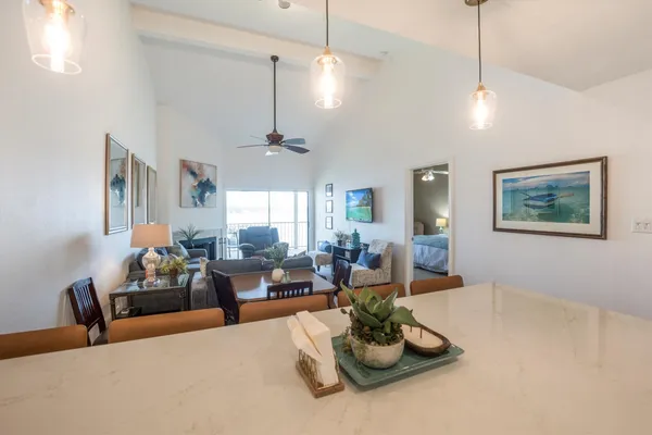 a kitchen with counter top space and wooden floor