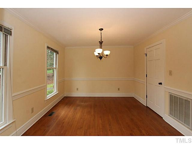 2700 Mattlyn Court Raleigh, NC 27613 - Photo 4 of 25 Hardwood floors and updated light fixture and door hardware Dining Room
