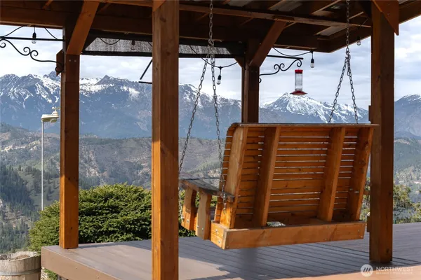 a view of a house with a mountain yard