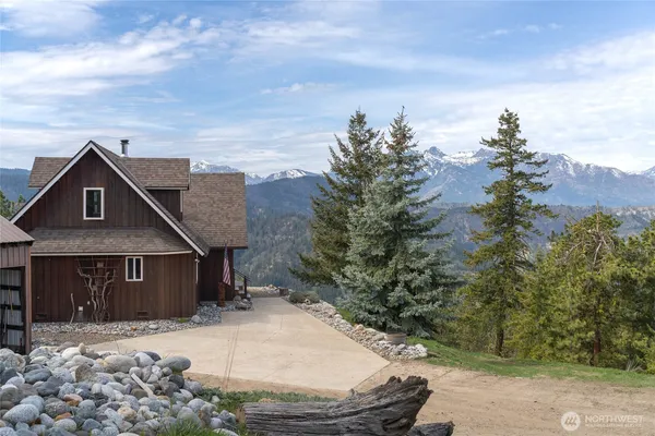 an aerial view of a house with outdoor space