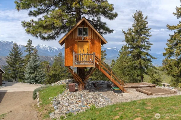 an aerial view of a house with mountain view