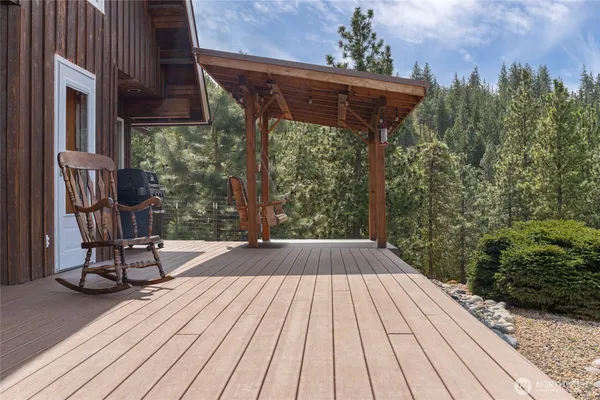 a view of a dining room with furniture wooden floor and chandelier