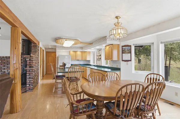 a kitchen with a sink a counter top space and a stove top oven