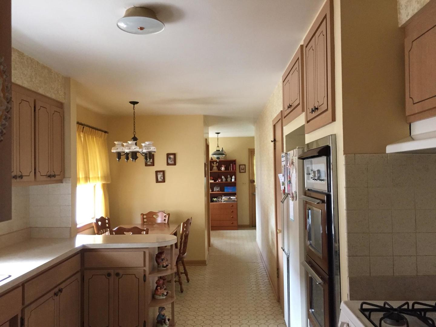 4500 Plainfield Avenue Norridge, IL 60706 - Photo 5 of 29 a kitchen with refrigerator and cabinets
