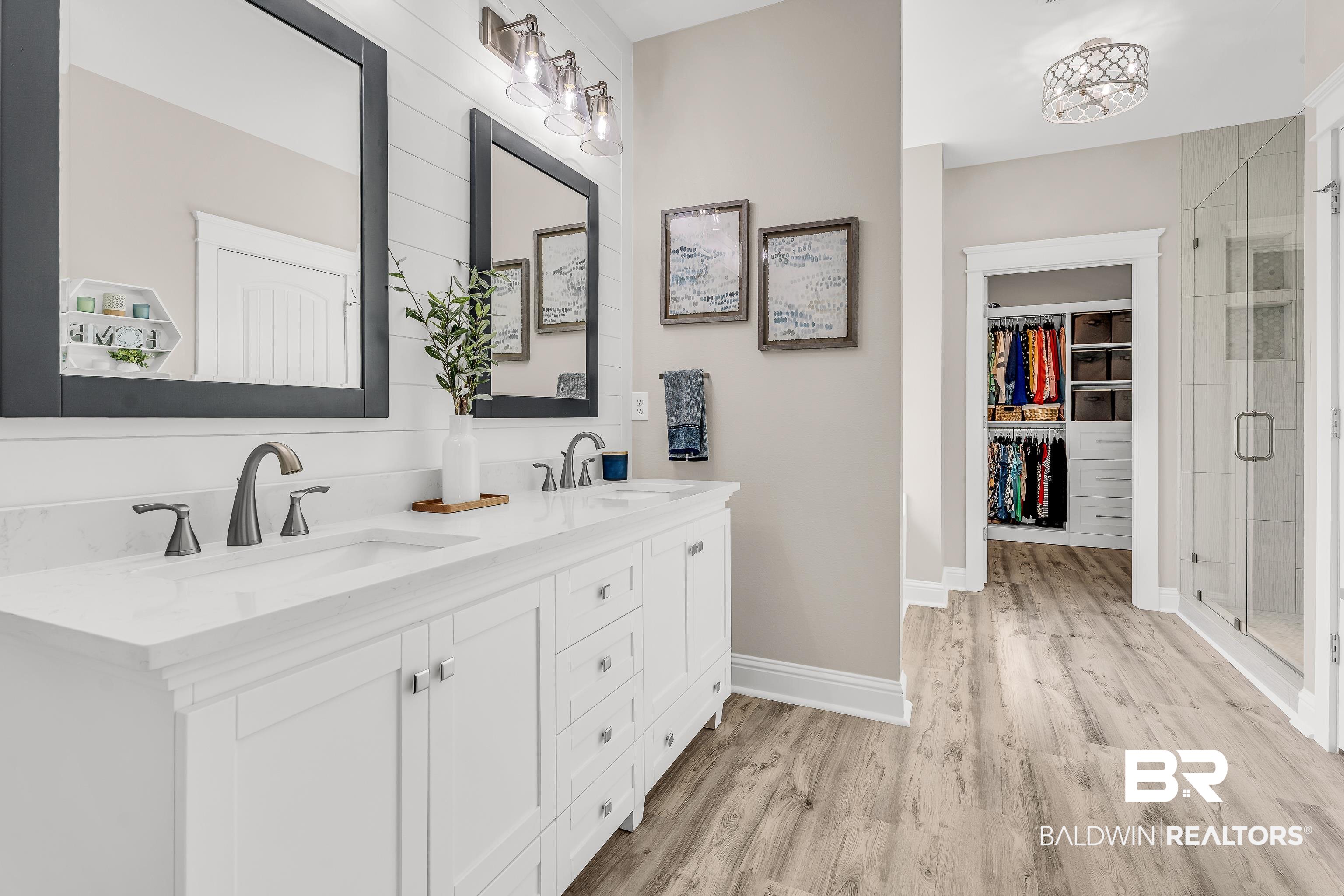 9675 Camberwell Drive Daphne, AL 36526 - Photo 20 of 34 Full bath with double vanity, a stall shower, a spacious closet, and wood finished floors