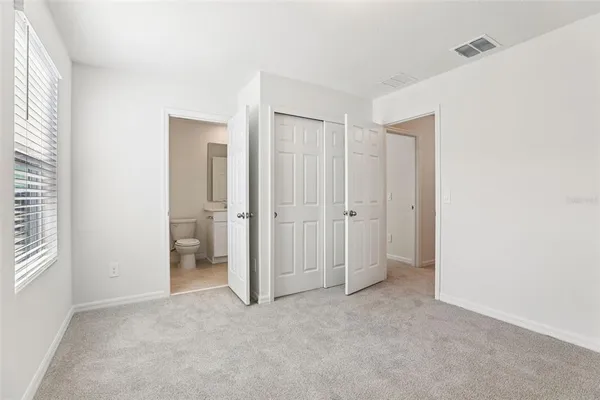 a view of a bathroom with a shower and a sink
