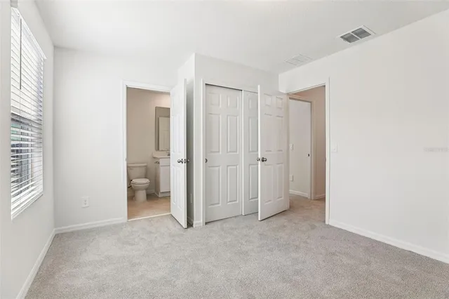 a view of a bathroom with a shower and a sink