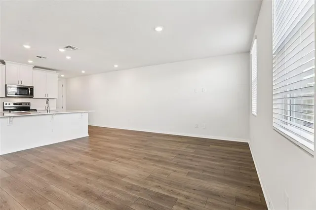 a view of kitchen with wooden floor