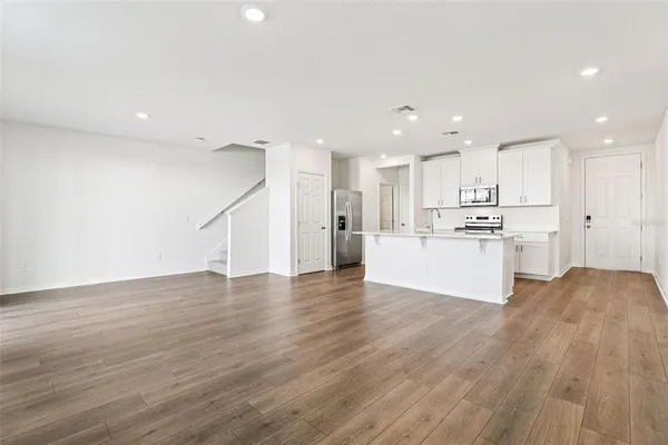 a view of kitchen with wooden floor