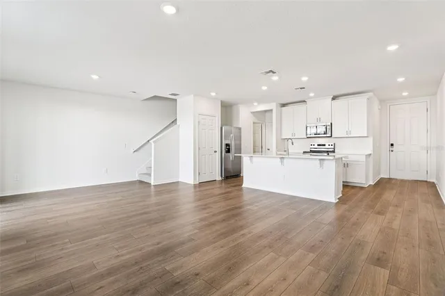 a view of kitchen with wooden floor
