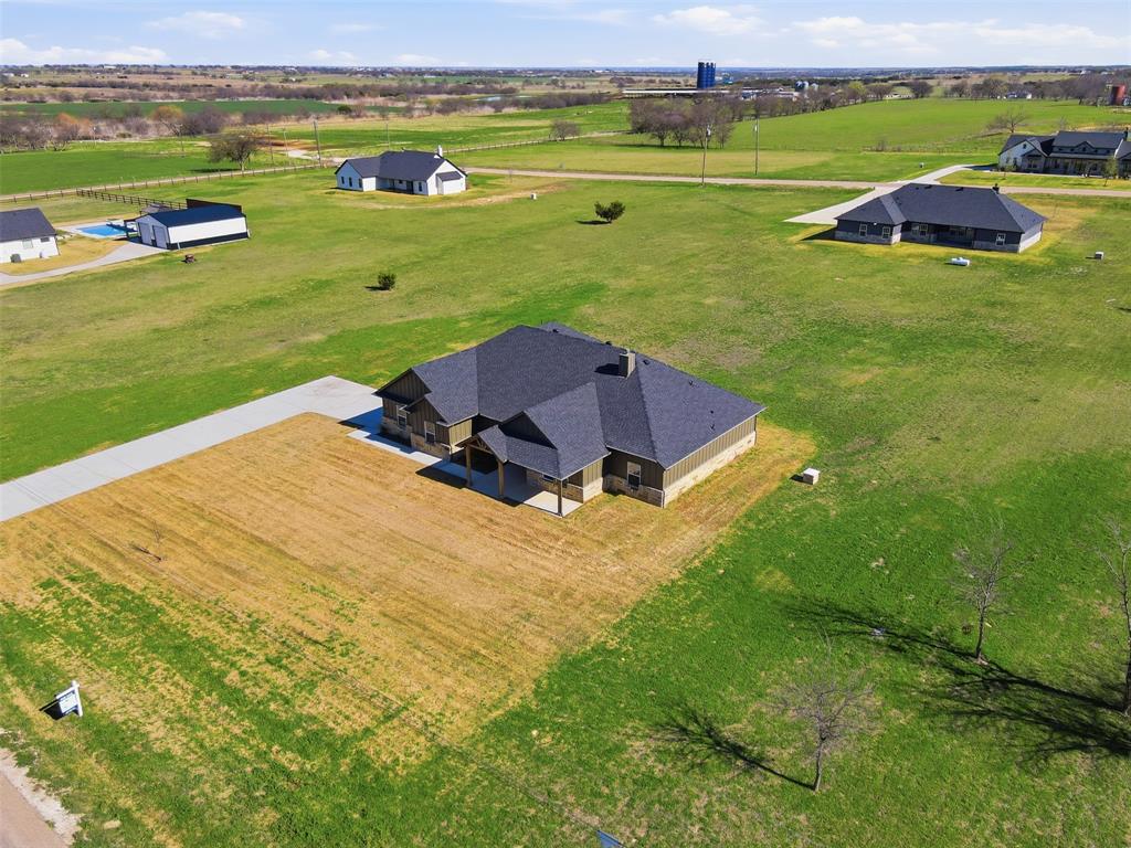 6657 Buffalo Ridge Circle Godley, TX 76044 - Photo 30 of 31 an aerial view of a house with a garden