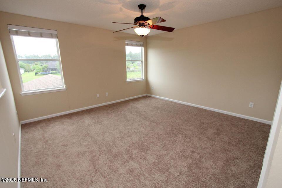 1288 Loch Tanna Loop St. Johns, FL 32259 - Photo 13 of 25 a view of an empty room with a window