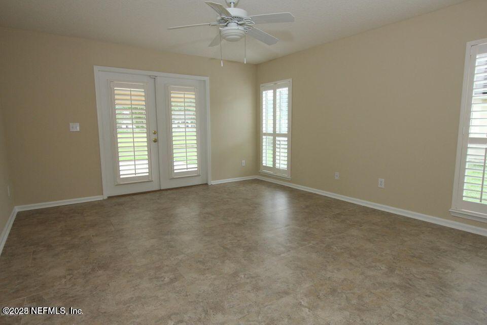 1288 Loch Tanna Loop St. Johns, FL 32259 - Photo 15 of 25 an empty room with windows and fan