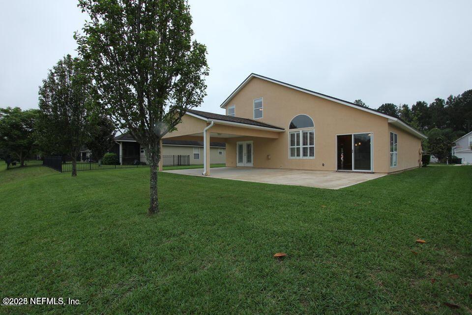 1288 Loch Tanna Loop St. Johns, FL 32259 - Photo 18 of 25 a view of a house with a backyard