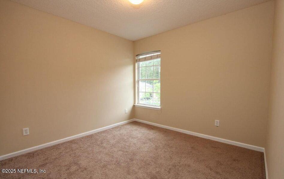 1288 Loch Tanna Loop St. Johns, FL 32259 - Photo 19 of 25 an empty room with a window