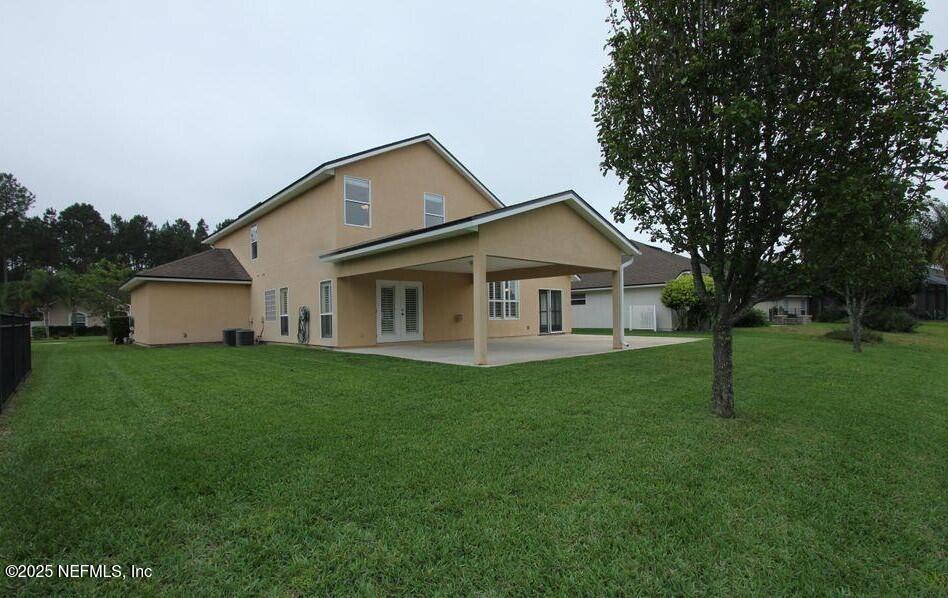 1288 Loch Tanna Loop St. Johns, FL 32259 - Photo 23 of 25 a view of a house with a big yard