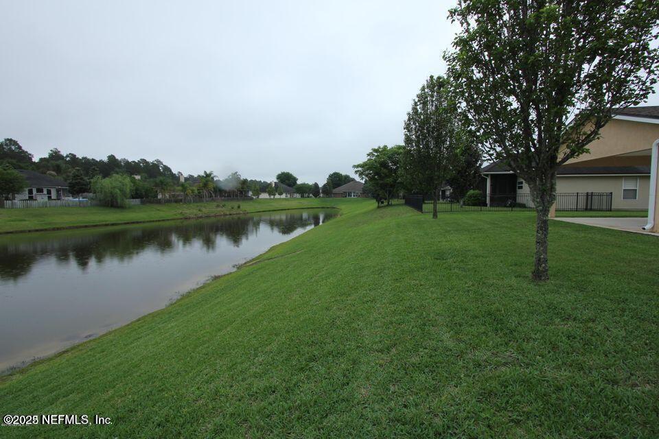 1288 Loch Tanna Loop St. Johns, FL 32259 - Photo 25 of 25 a view of a lake with houses in the background