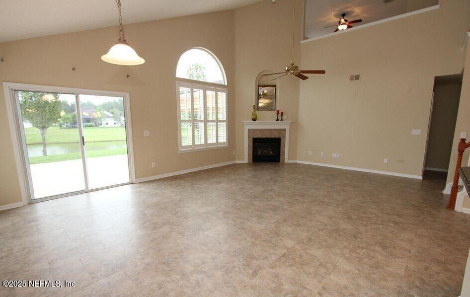 1288 Loch Tanna Loop St. Johns, FL 32259 - Photo 6 of 25 an empty room with windows and fireplace