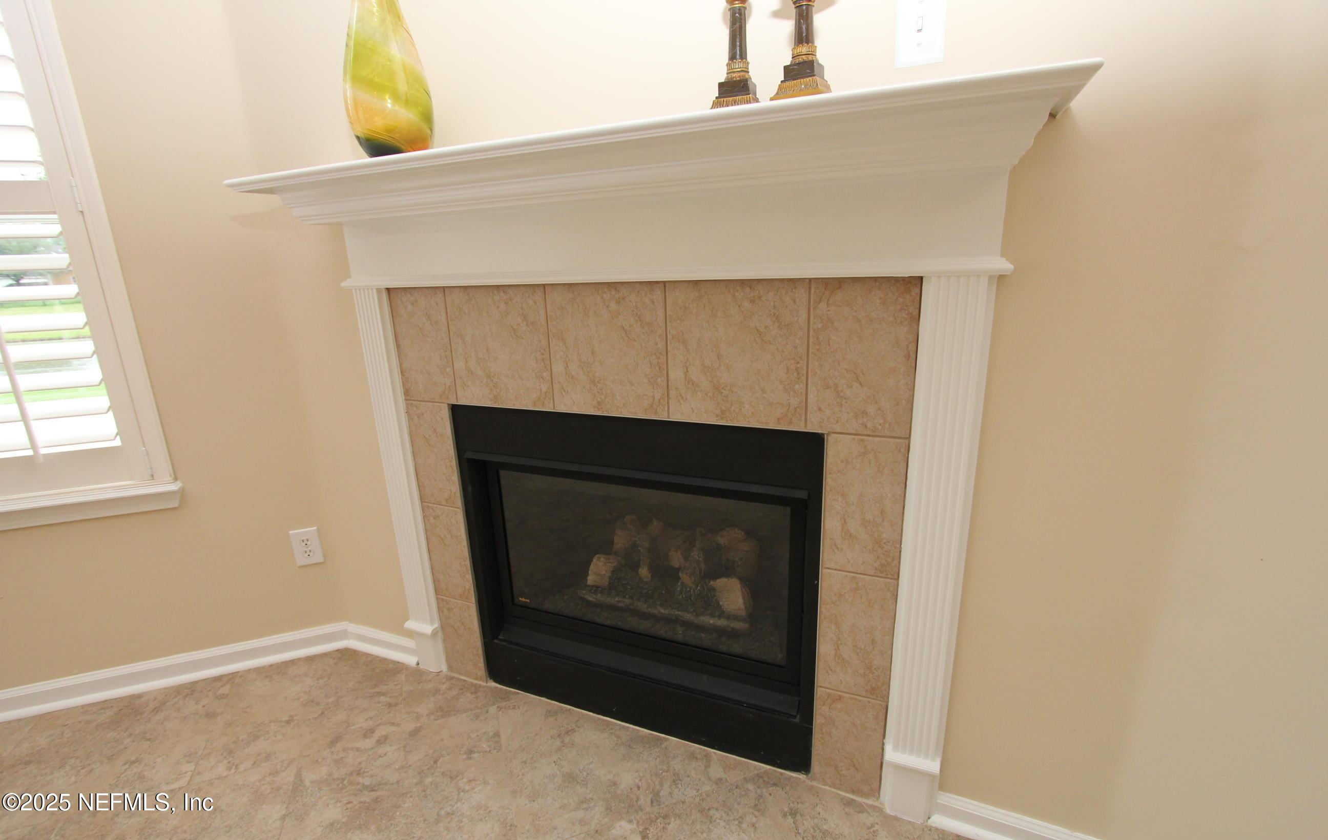 1288 Loch Tanna Loop St. Johns, FL 32259 - Photo 8 of 25 a living room with a fireplace