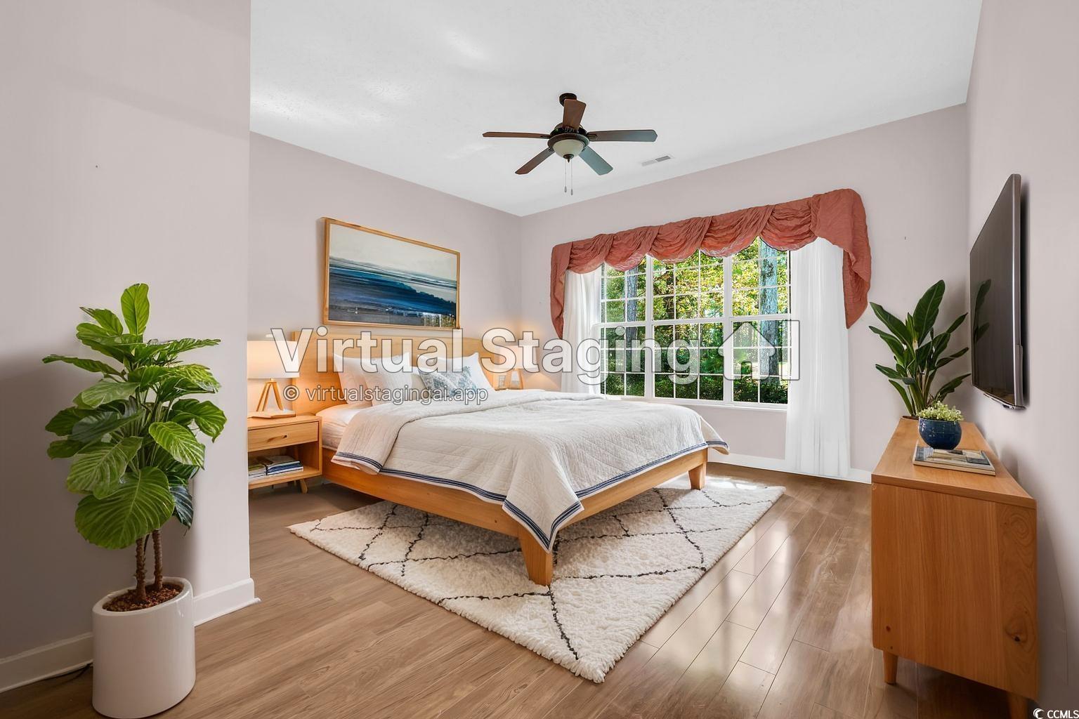 9350 Pinckney Lane Murrells Inlet, SC 29576 - Photo 14 of 40 Bedroom with light wood finished floors and ceiling fan
