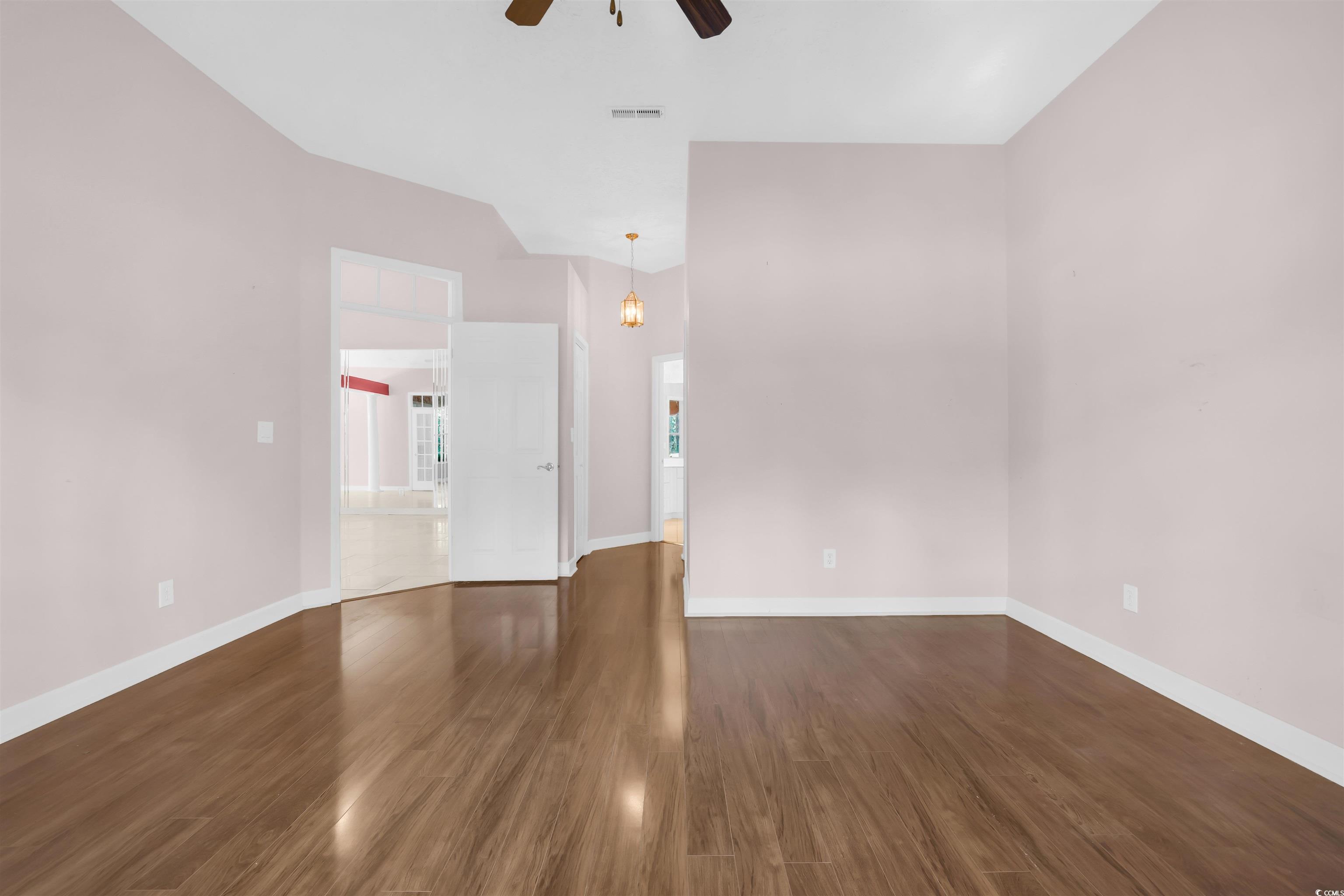 9350 Pinckney Lane Murrells Inlet, SC 29576 - Photo 16 of 40 Spare room with dark wood-type flooring and ceiling fan