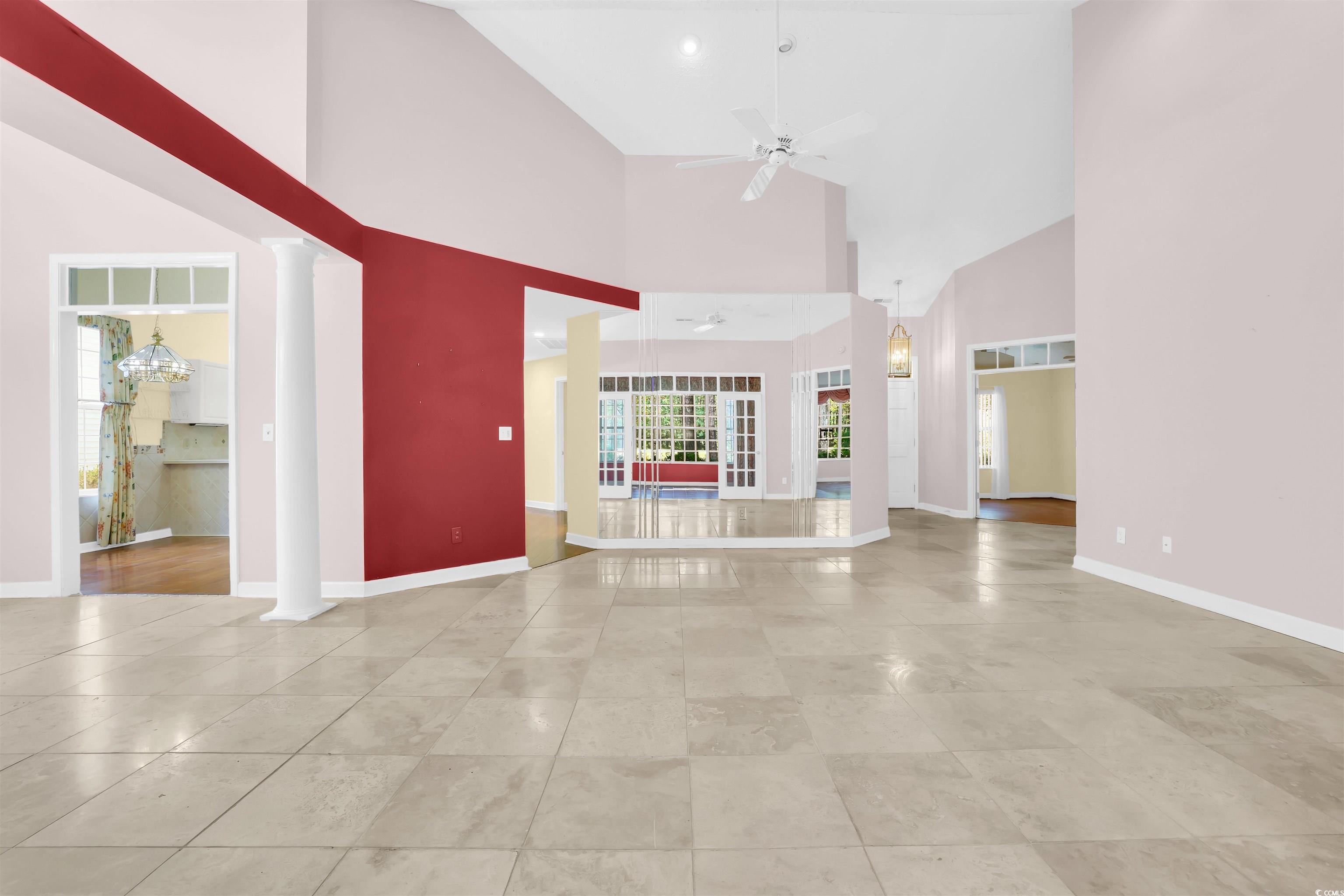 9350 Pinckney Lane Murrells Inlet, SC 29576 - Photo 26 of 40 Unfurnished living room featuring high vaulted ceiling, ceiling fan, and light tile patterned floors