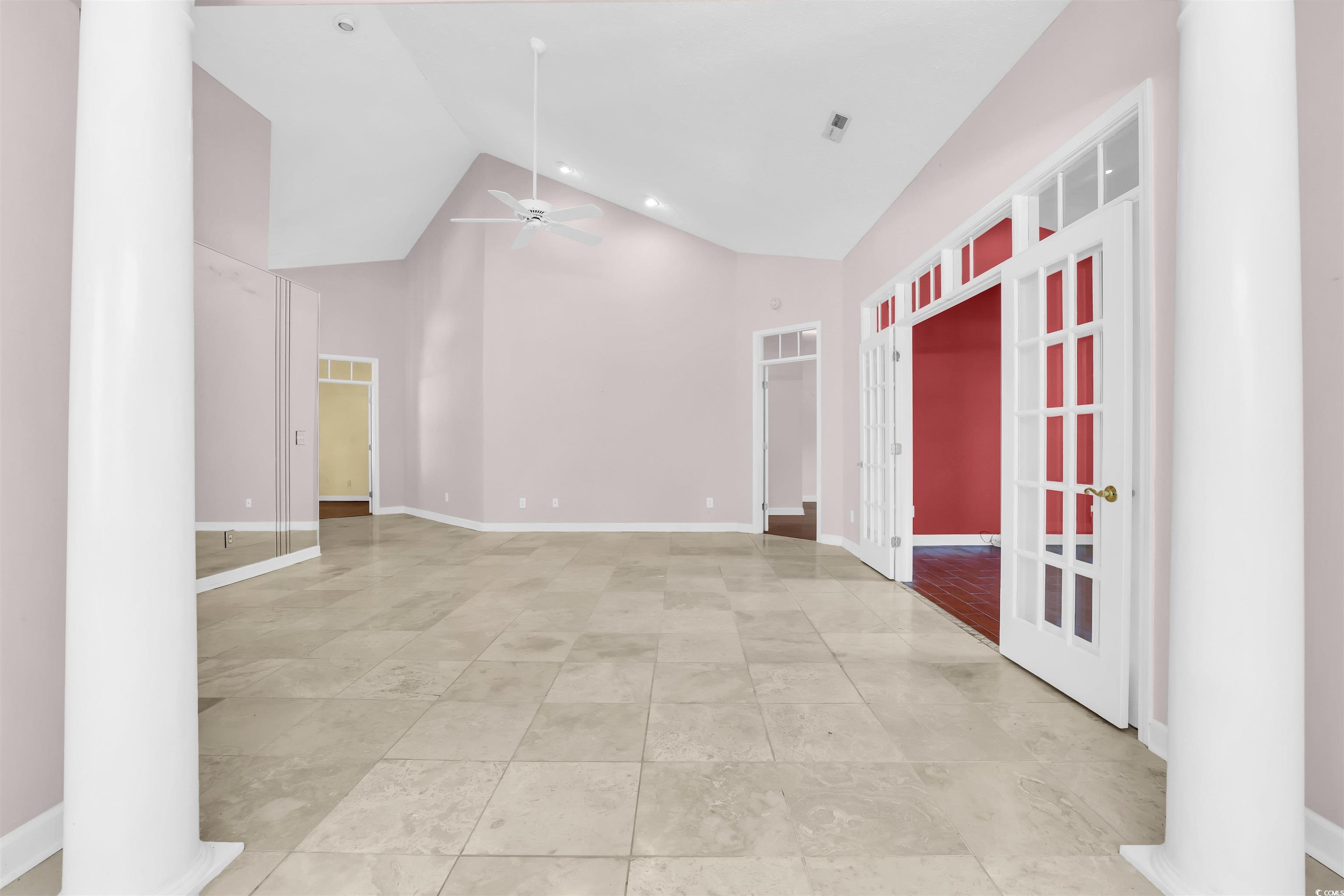 9350 Pinckney Lane Murrells Inlet, SC 29576 - Photo 27 of 40 Unfurnished room featuring high vaulted ceiling, a ceiling fan, french doors, and light tile patterned floors