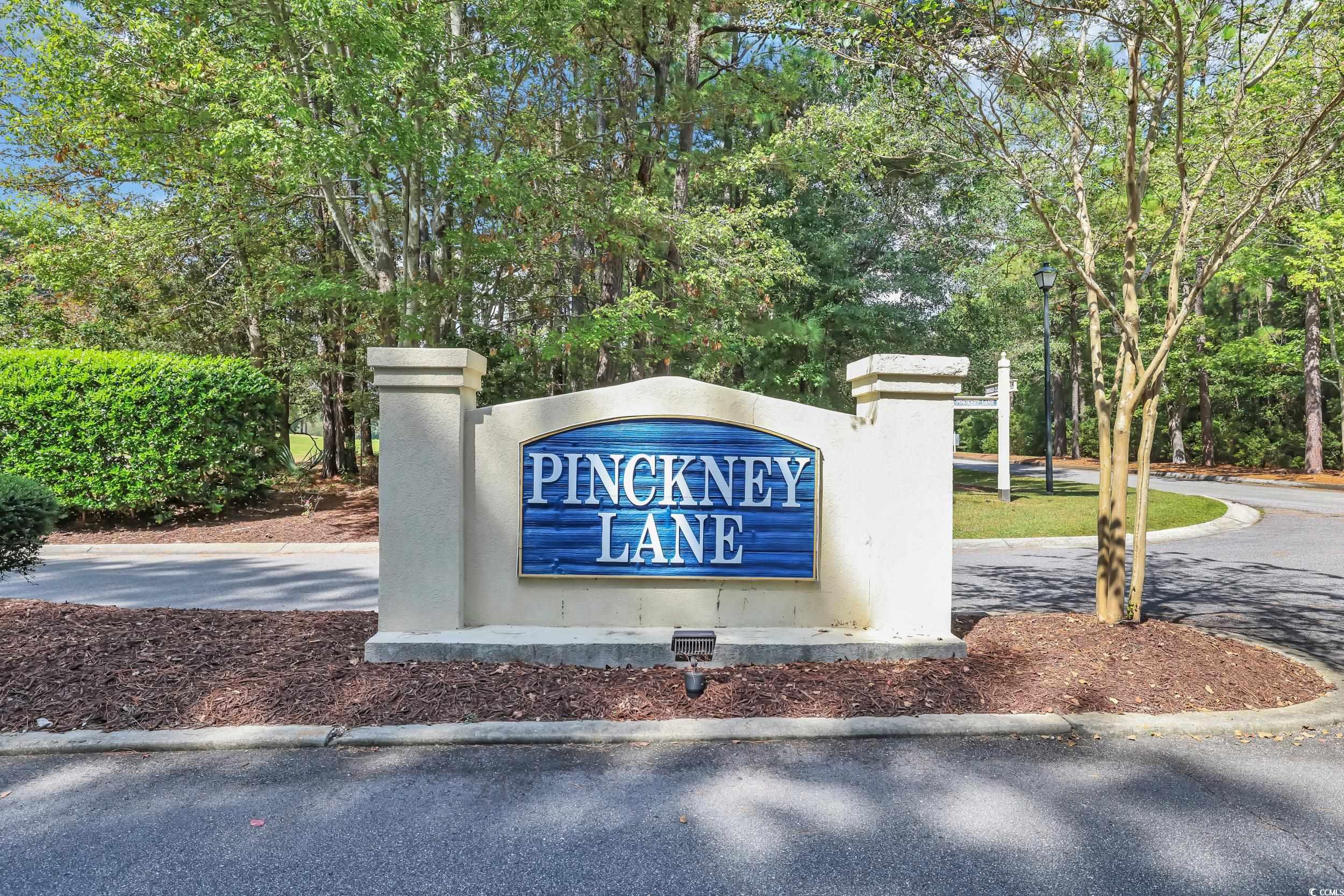 9350 Pinckney Lane Murrells Inlet, SC 29576 - Photo 33 of 40 Community / neighborhood sign with view of wooded area
