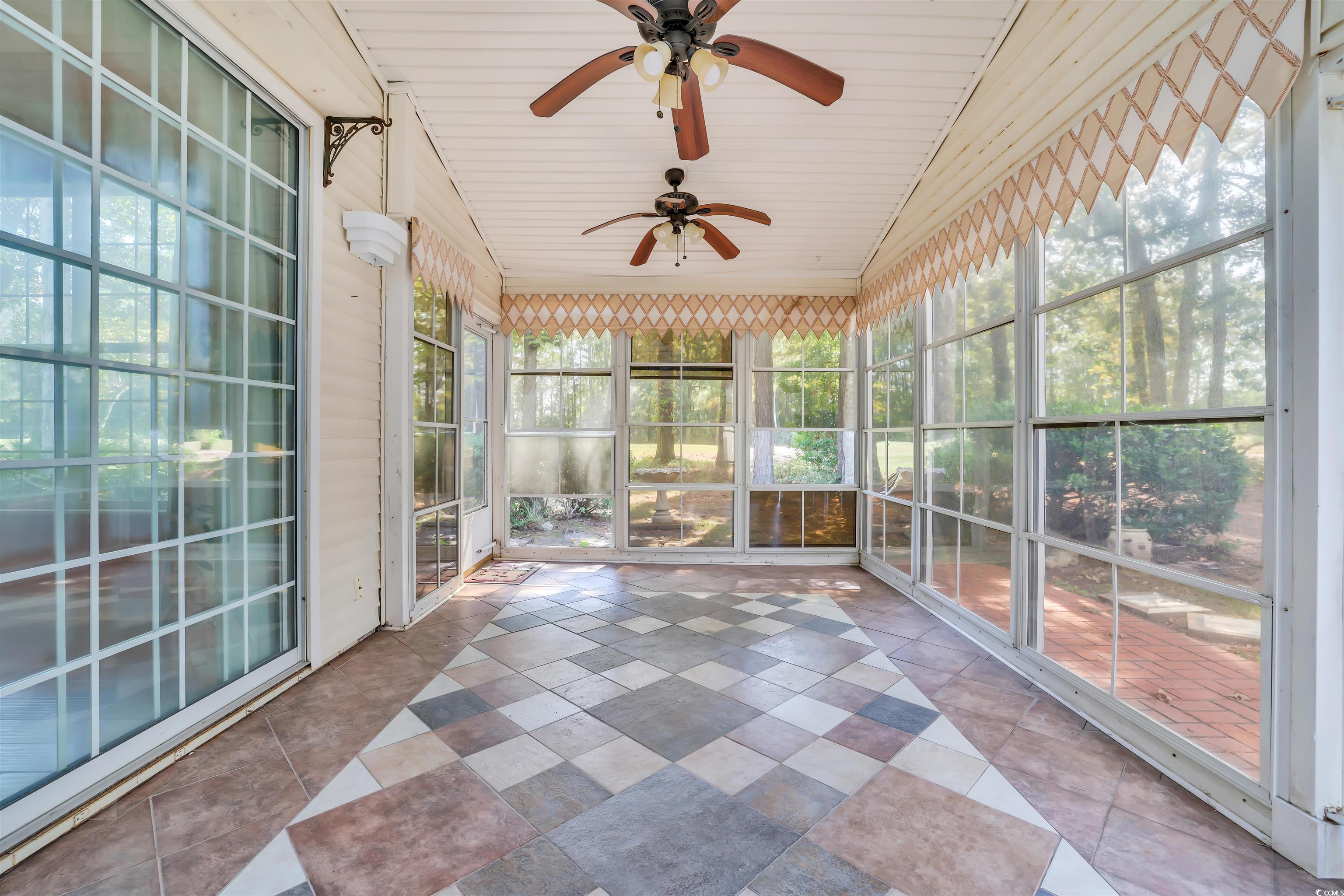 9350 Pinckney Lane Murrells Inlet, SC 29576 - Photo 5 of 40 Unfurnished sunroom with ceiling fan