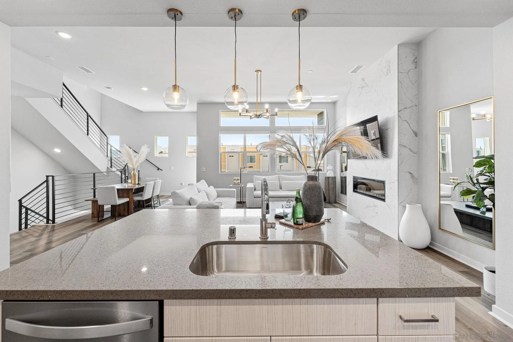 3002 Bravo Loop, Unit 4 Chula Vista, CA 91915 - Photo 14 of 38 a view of a kitchen with kitchen island a large counter top space a sink and appliances