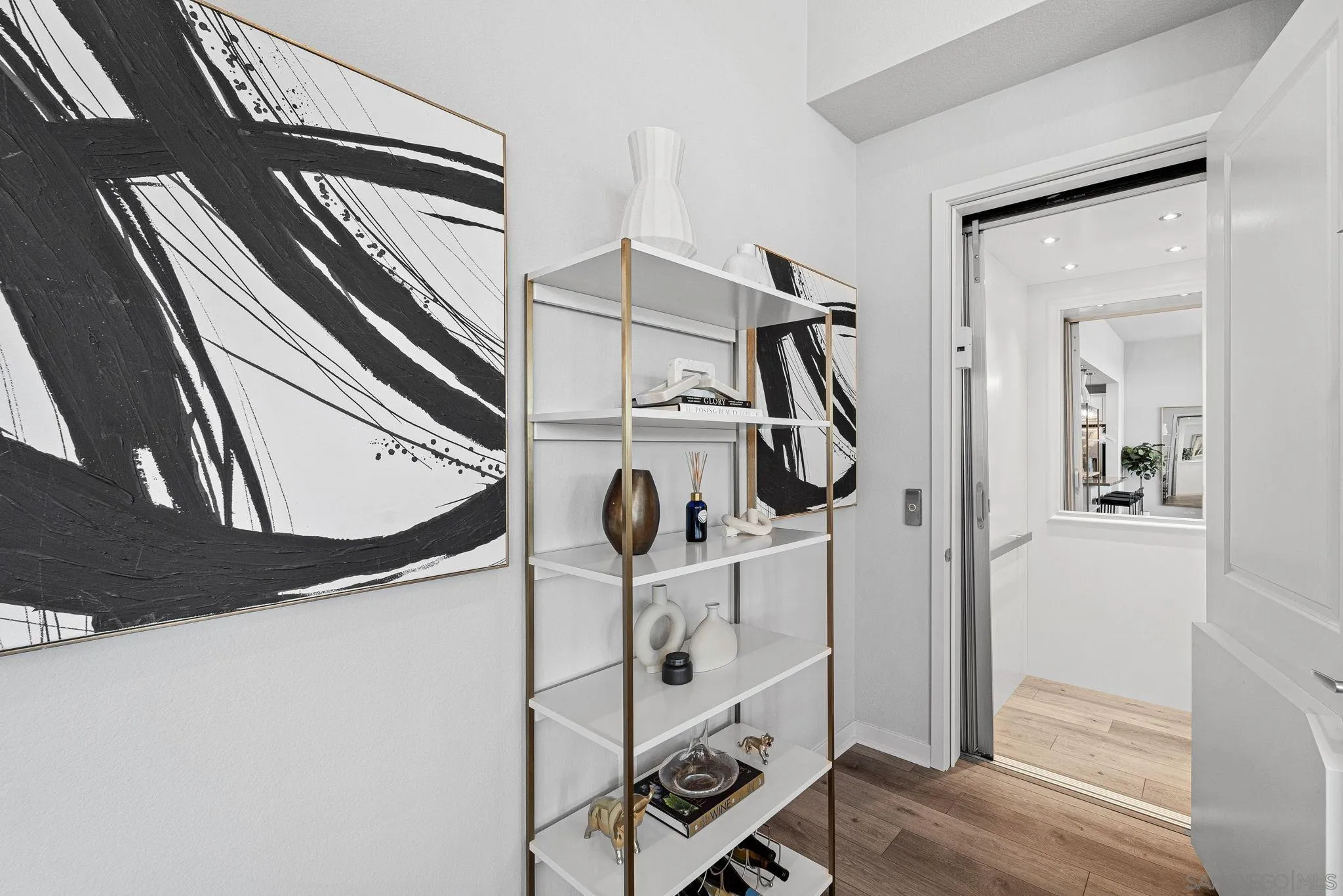 3002 Bravo Loop, Unit 4 Chula Vista, CA 91915 - Photo 17 of 38 a view of an entryway with wooden floor