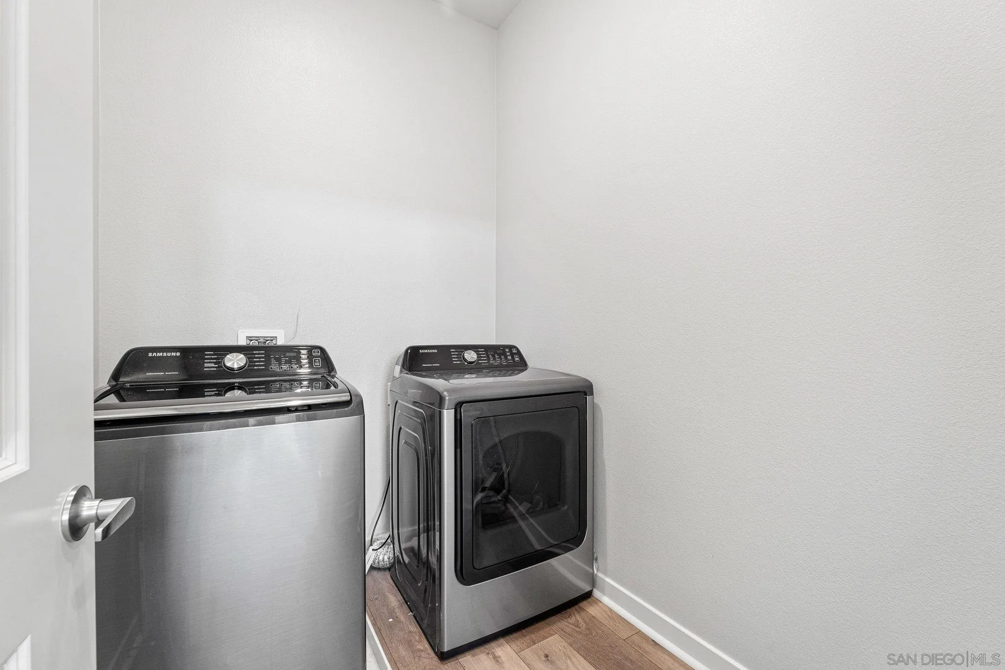 3002 Bravo Loop, Unit 4 Chula Vista, CA 91915 - Photo 20 of 38 a utility room with dryer and washer