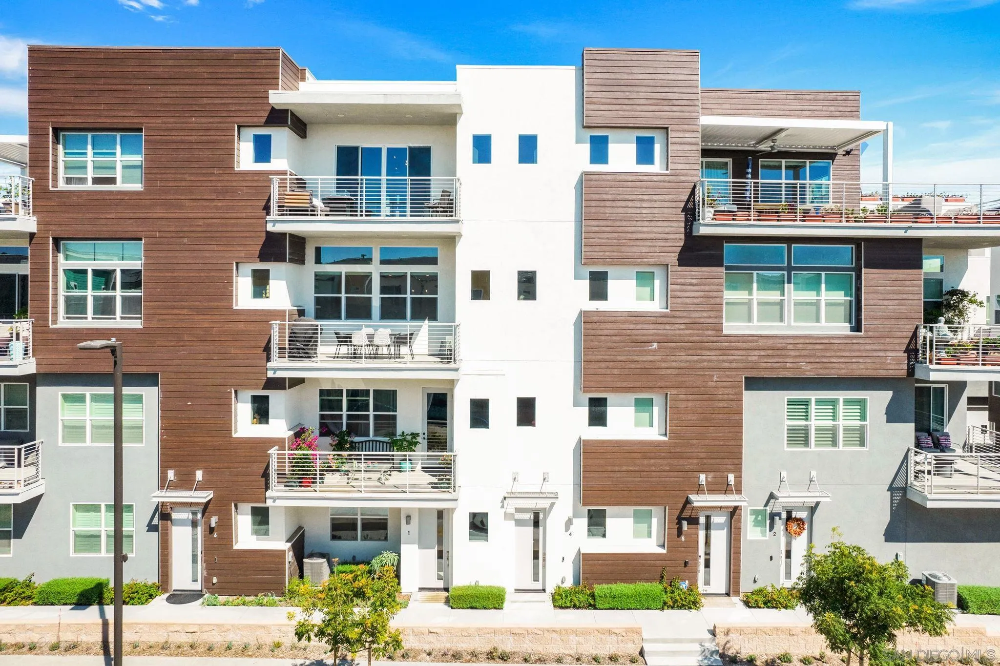 3002 Bravo Loop, Unit 4 Chula Vista, CA 91915 - Photo 2 of 38 a front view of a multi story building