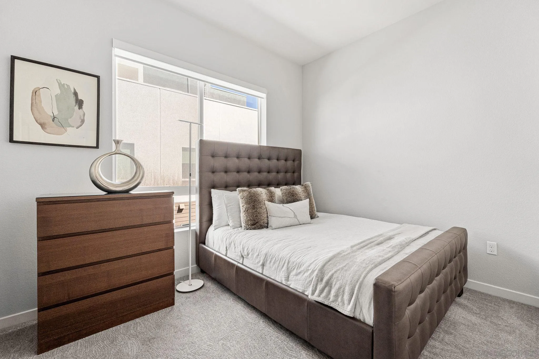 3002 Bravo Loop, Unit 4 Chula Vista, CA 91915 - Photo 22 of 38 a bedroom with a bed and painting on the wall