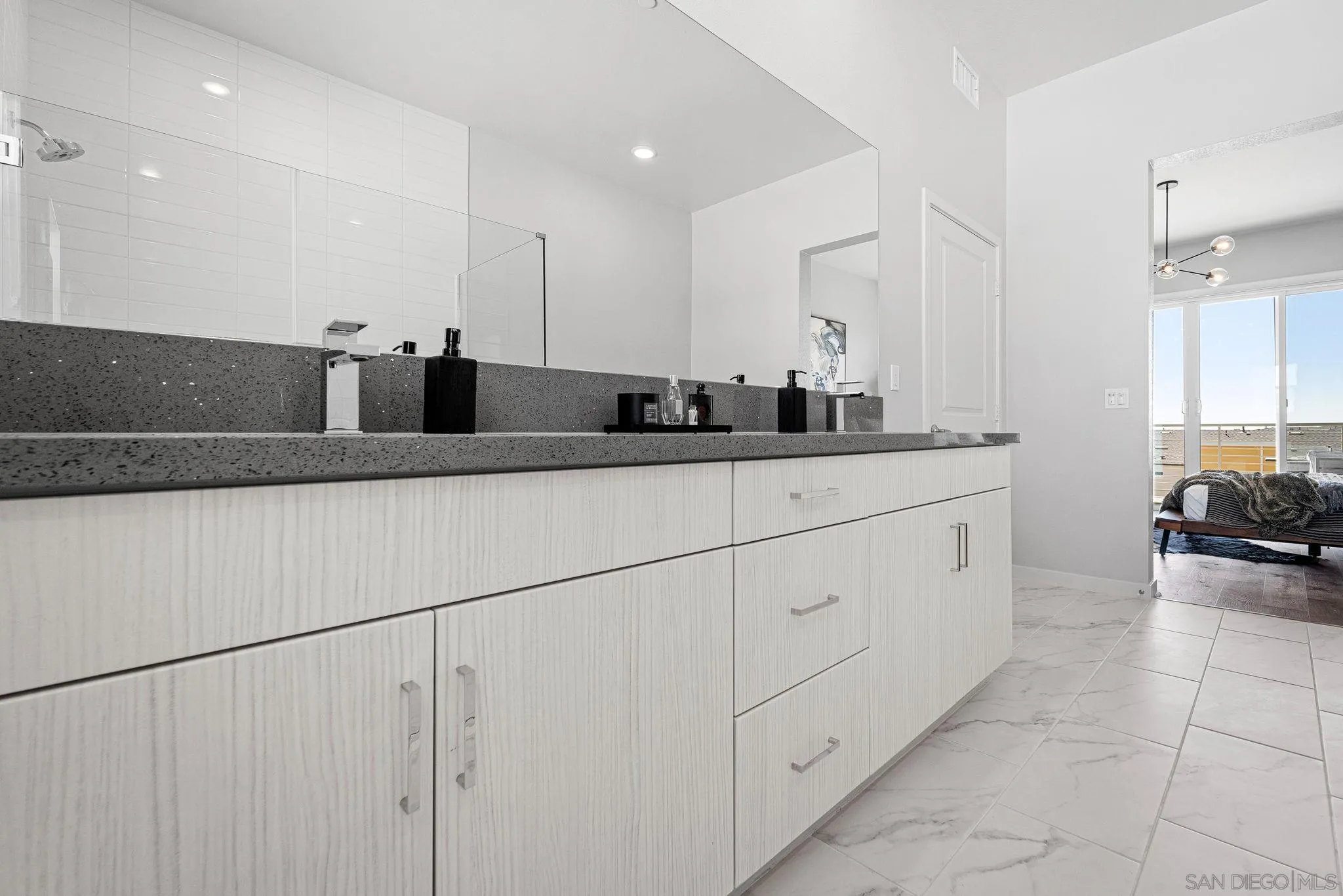 3002 Bravo Loop, Unit 4 Chula Vista, CA 91915 - Photo 27 of 38 a kitchen with a sink and cabinets