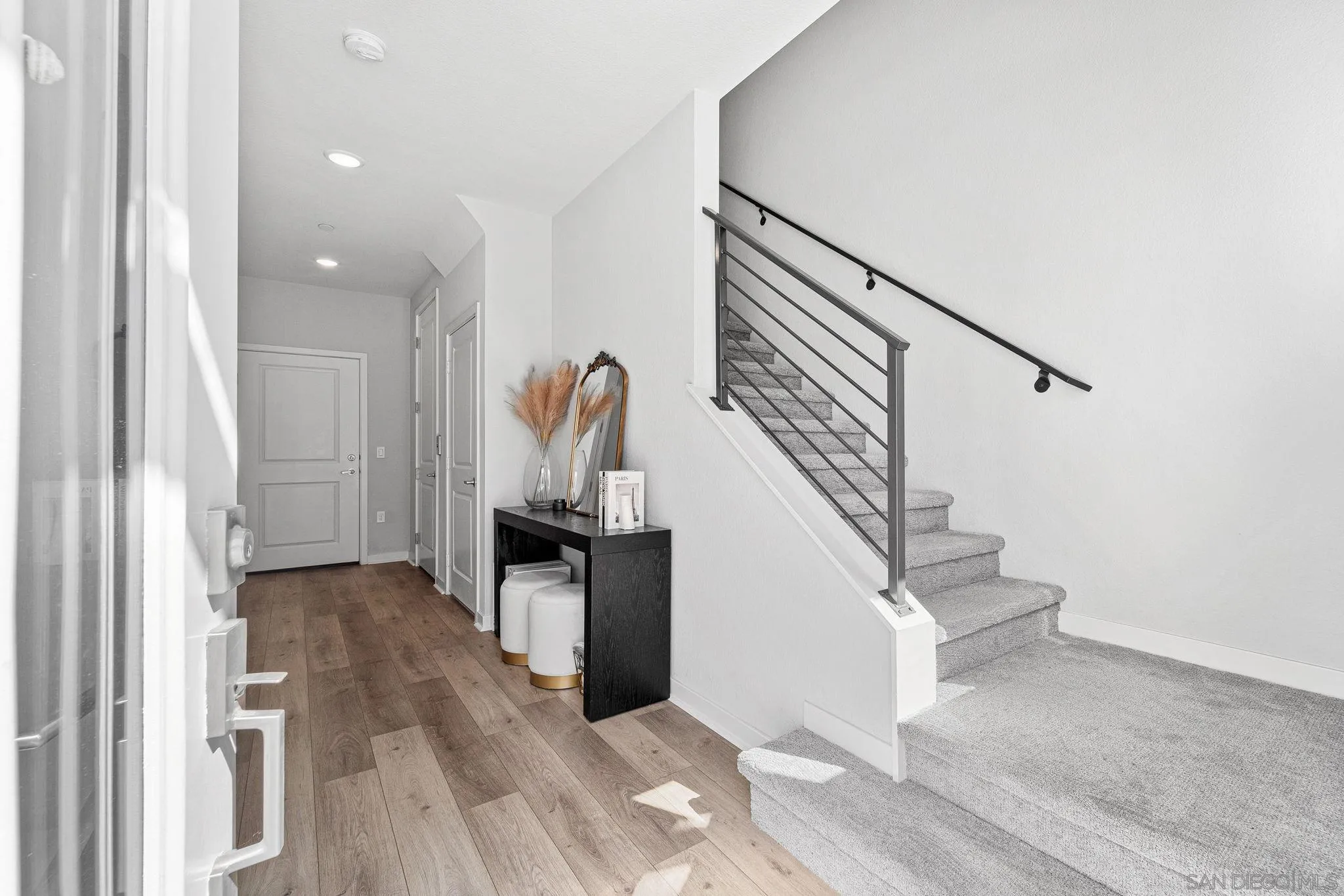 3002 Bravo Loop, Unit 4 Chula Vista, CA 91915 - Photo 3 of 38 a view of entryway and hall with wooden floor