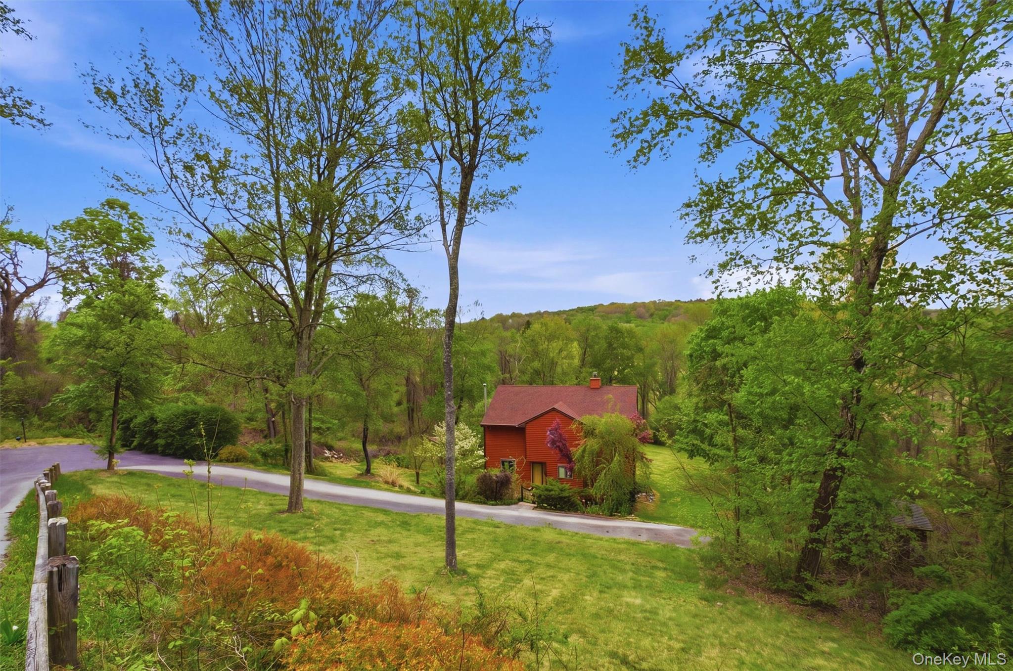 a backyard of a house with lots of green space