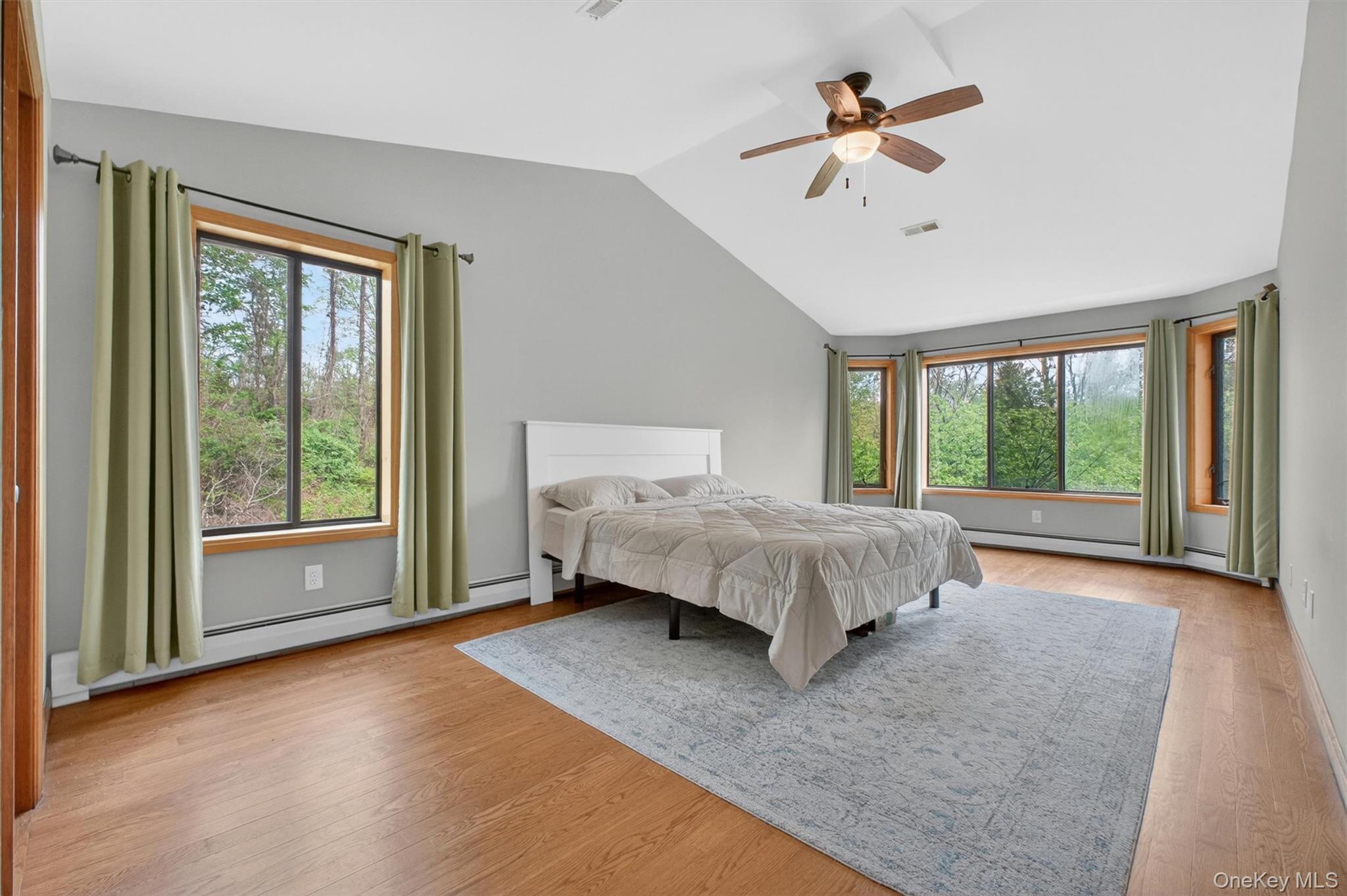 85 Ward Road Salt Point, NY 12578 - Photo 27 of 49 a spacious bedroom with a large bed and a chandelier fan