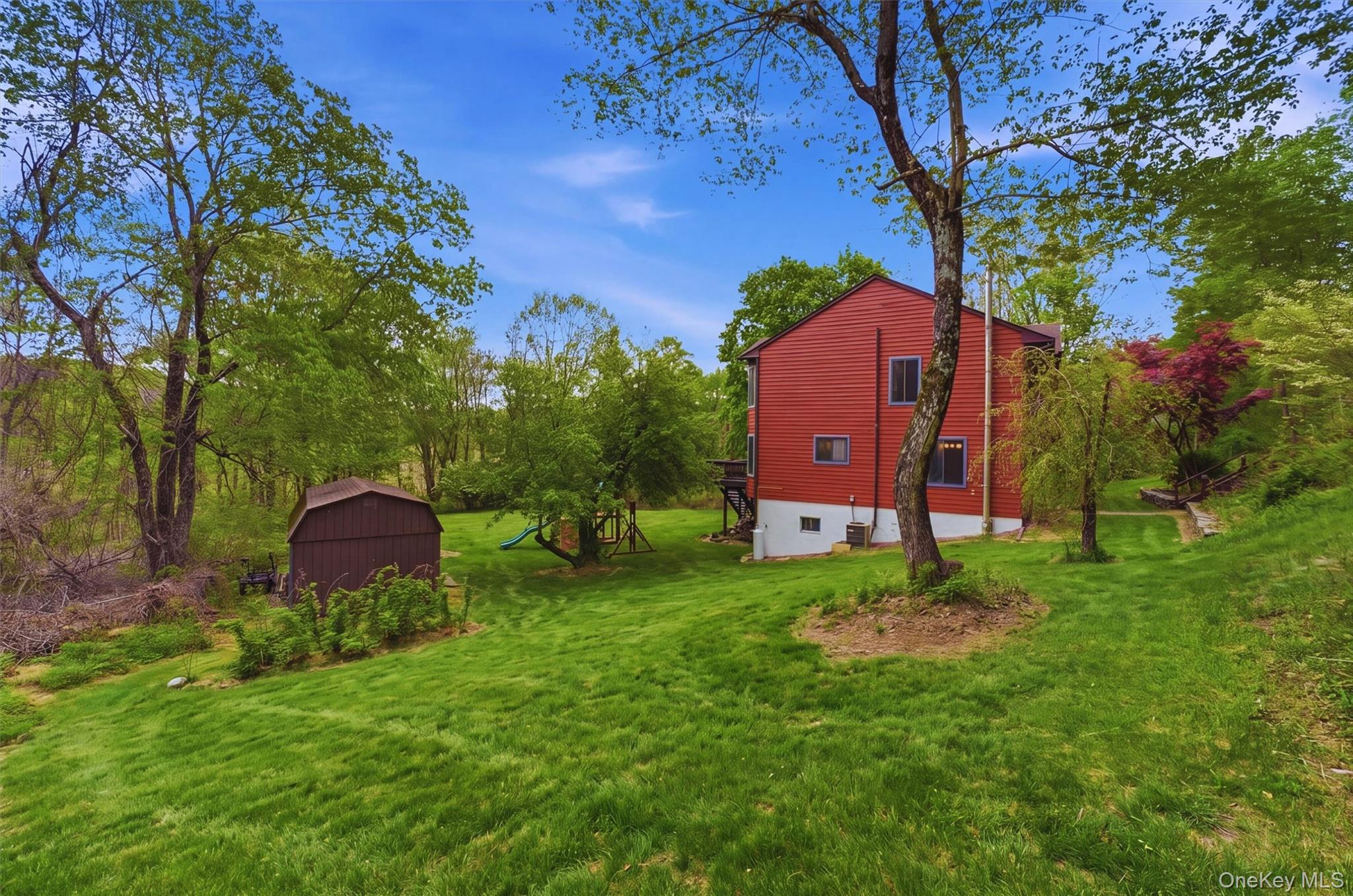 85 Ward Road Salt Point, NY 12578 - Photo 43 of 49 a view of a backyard with potted plants and large trees