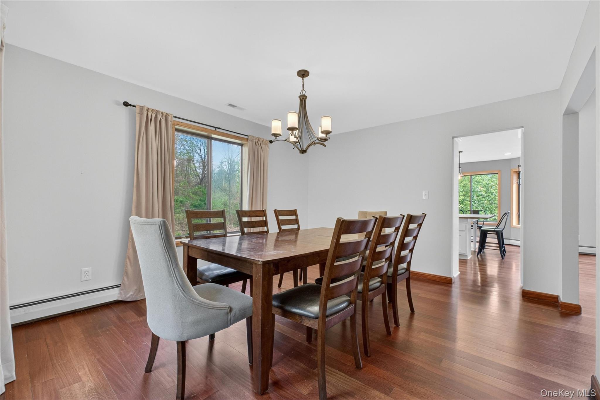 85 Ward Road Salt Point, NY 12578 - Photo 8 of 49 a view of a dining room with furniture window and wooden floor