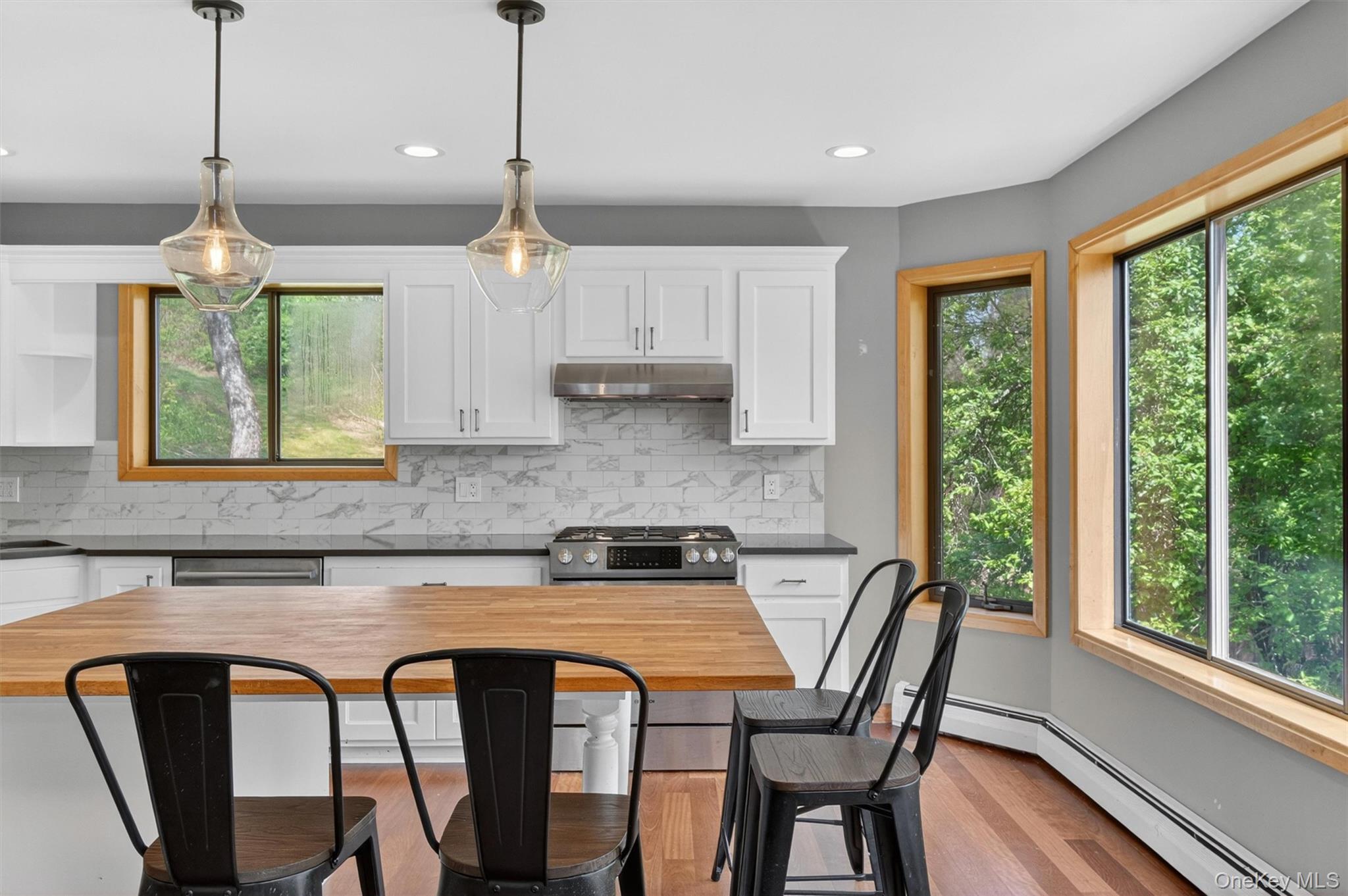 85 Ward Road Salt Point, NY 12578 - Photo 10 of 49 a kitchen that has a table chairs and a wooden floor