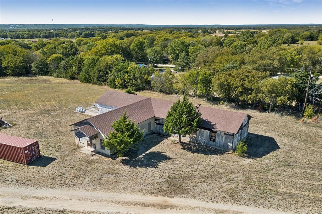 2591 Fm 1204 Decatur, TX 76234 - Photo 14 of 15 View of subject property with a heavily wooded area