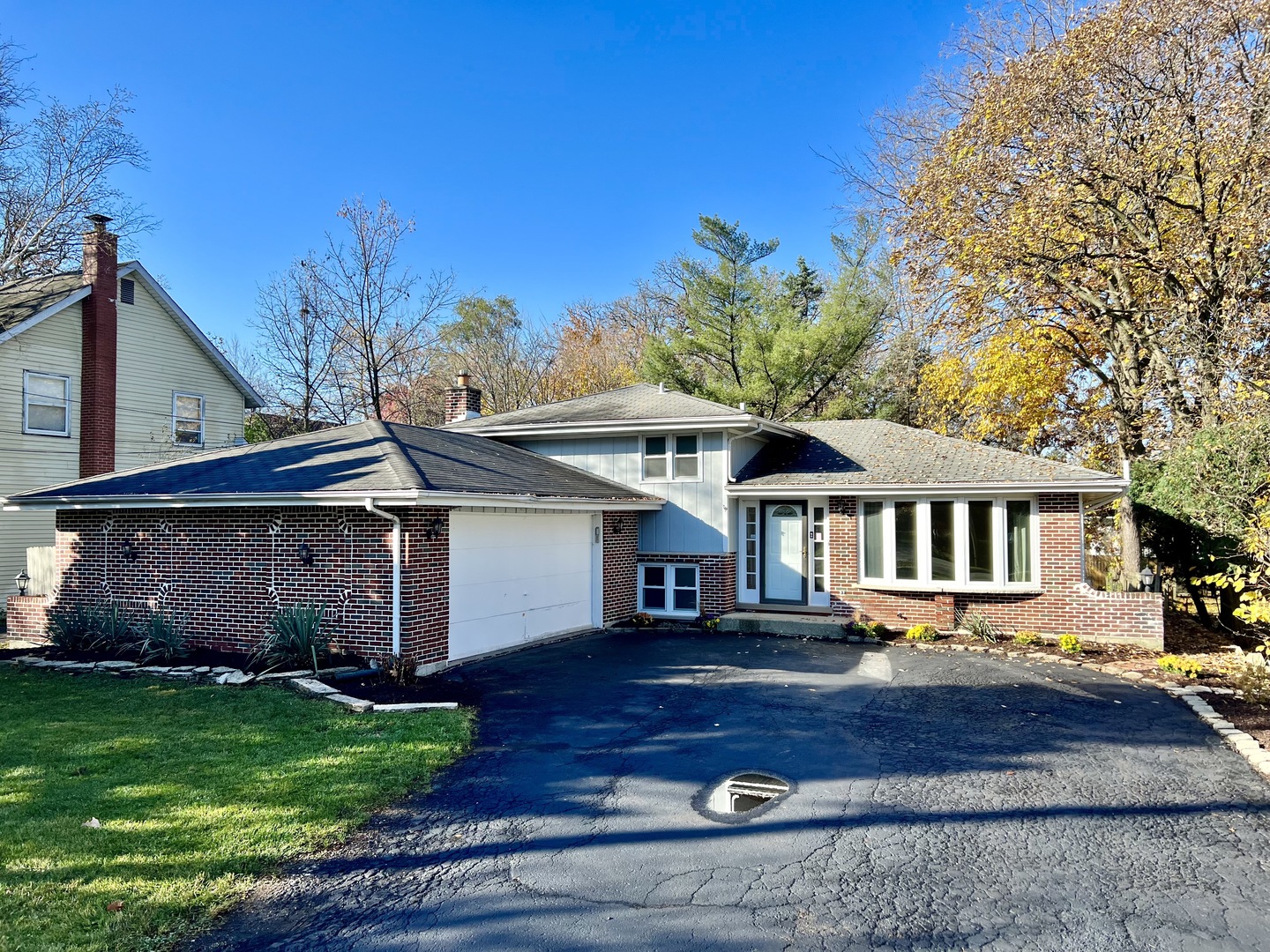 5740 Wolf Road Western Springs, IL 60558 - Photo 1 of 26 a front view of a house with garden